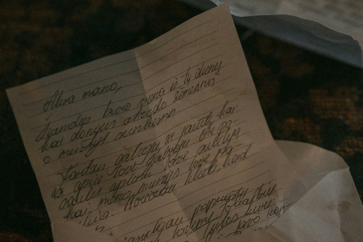 Handwritten letters on a wooden surface