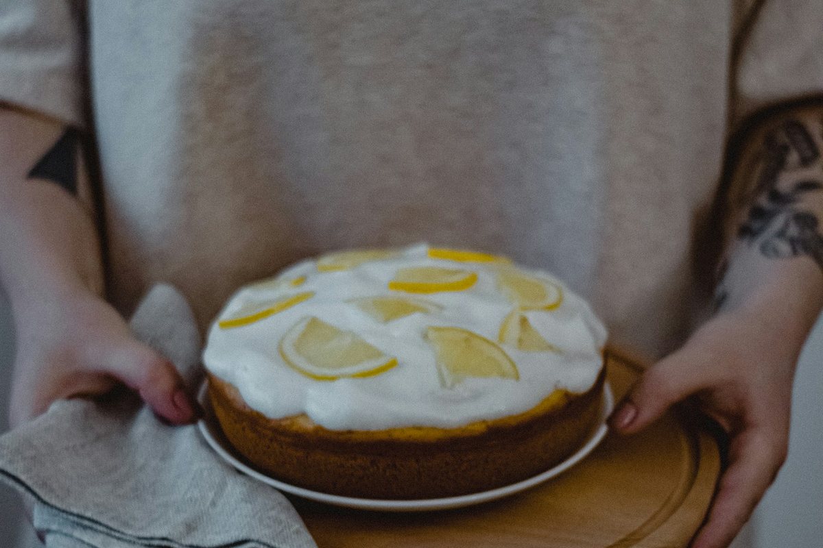a person holding a cake